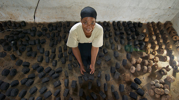 Legacy Foundation works with woman's project in Lushoto, Tanzania to develop alternative fuel from biomass, known as fuel briquettes. Photography by Peter Stanley, 2012.