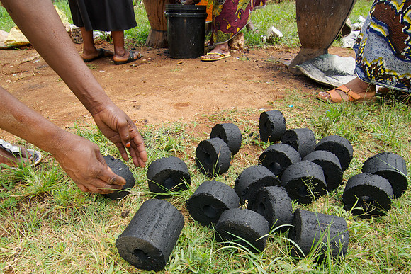 Legacy Foundation works with woman's project in Lushoto, Tanzania to develop alternative fuel from biomass, known as fuel briquettes. Photography by Peter Stanley, 2012.