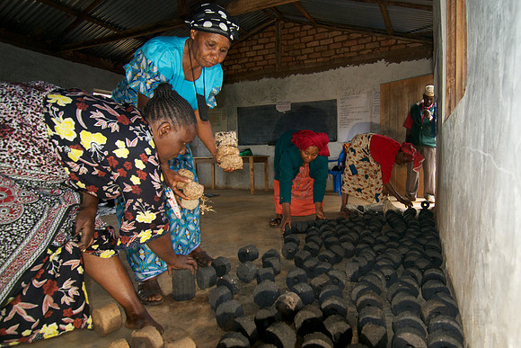 Legacy Foundation works with woman's project in Lushoto, Tanzania to develop alternative fuel from biomass, known as fuel briquettes. Photography by Peter Stanley, 2012.