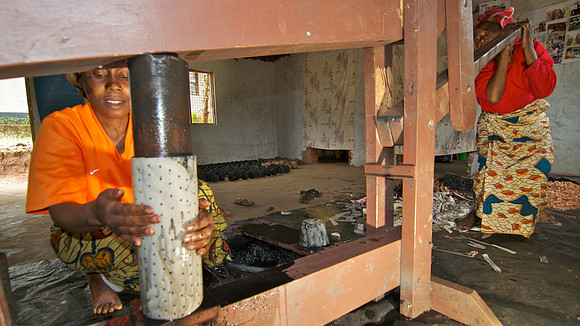Legacy Foundation works with woman's project in Lushoto, Tanzania to develop alternative fuel from biomass, known as fuel briquettes. Photography by Peter Stanley, 2012.