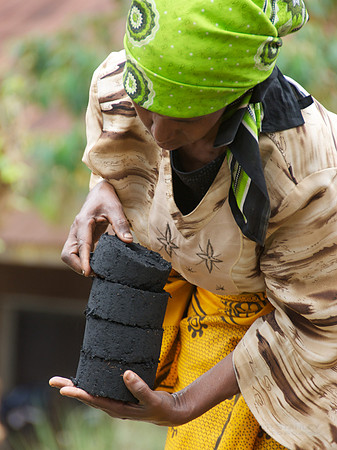 Legacy Foundation works with woman's project in Lushoto, Tanzania to develop alternative fuel from biomass, known as fuel briquettes. Photography by Peter Stanley, 2012.